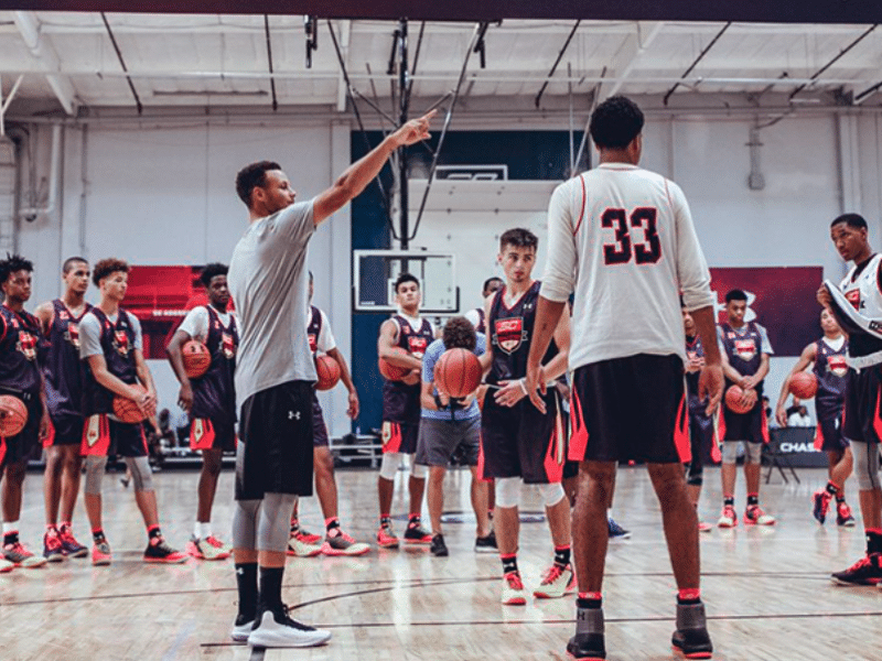 Steph Curry mentoring youth basketball players at SC30 Select Camp